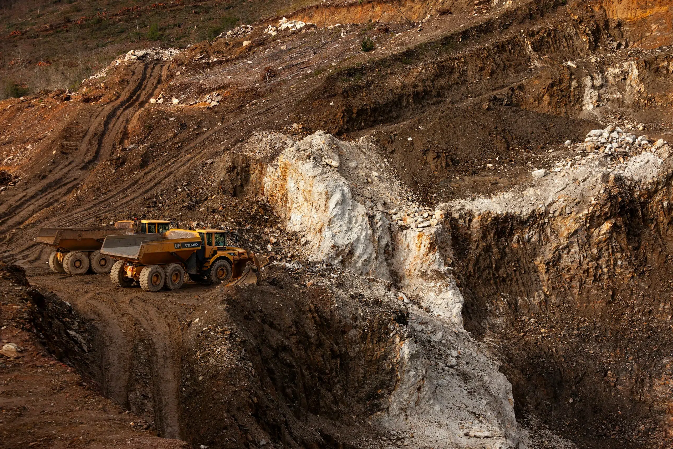 Excavation equipment at an open-pit mineral site